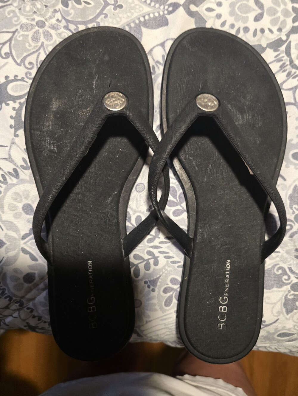BCBGeneration Black Flip Flop Sandals with Logo Medallion
